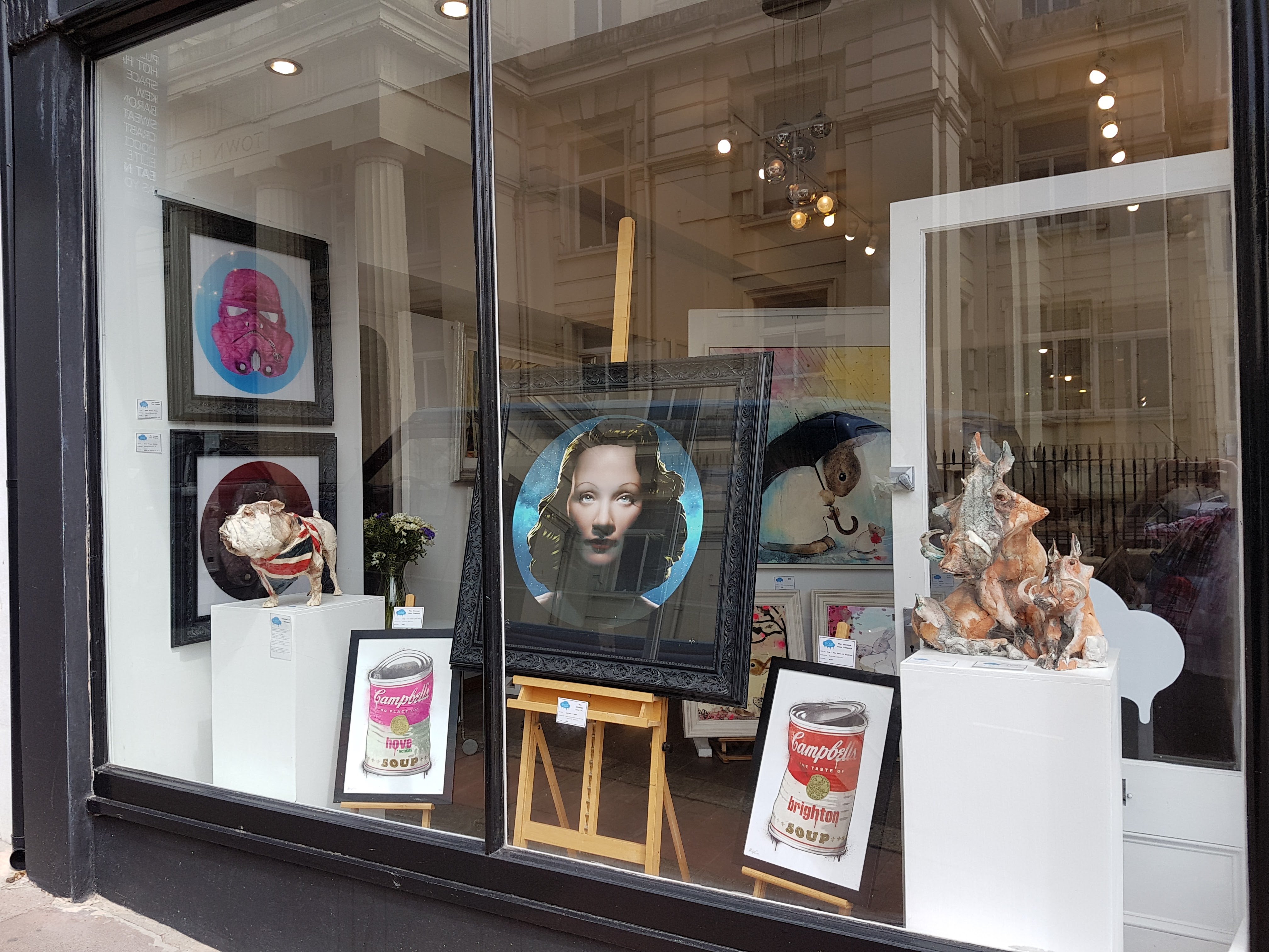 Gallery window with the Hove and Brighton soup cans and pink trooper