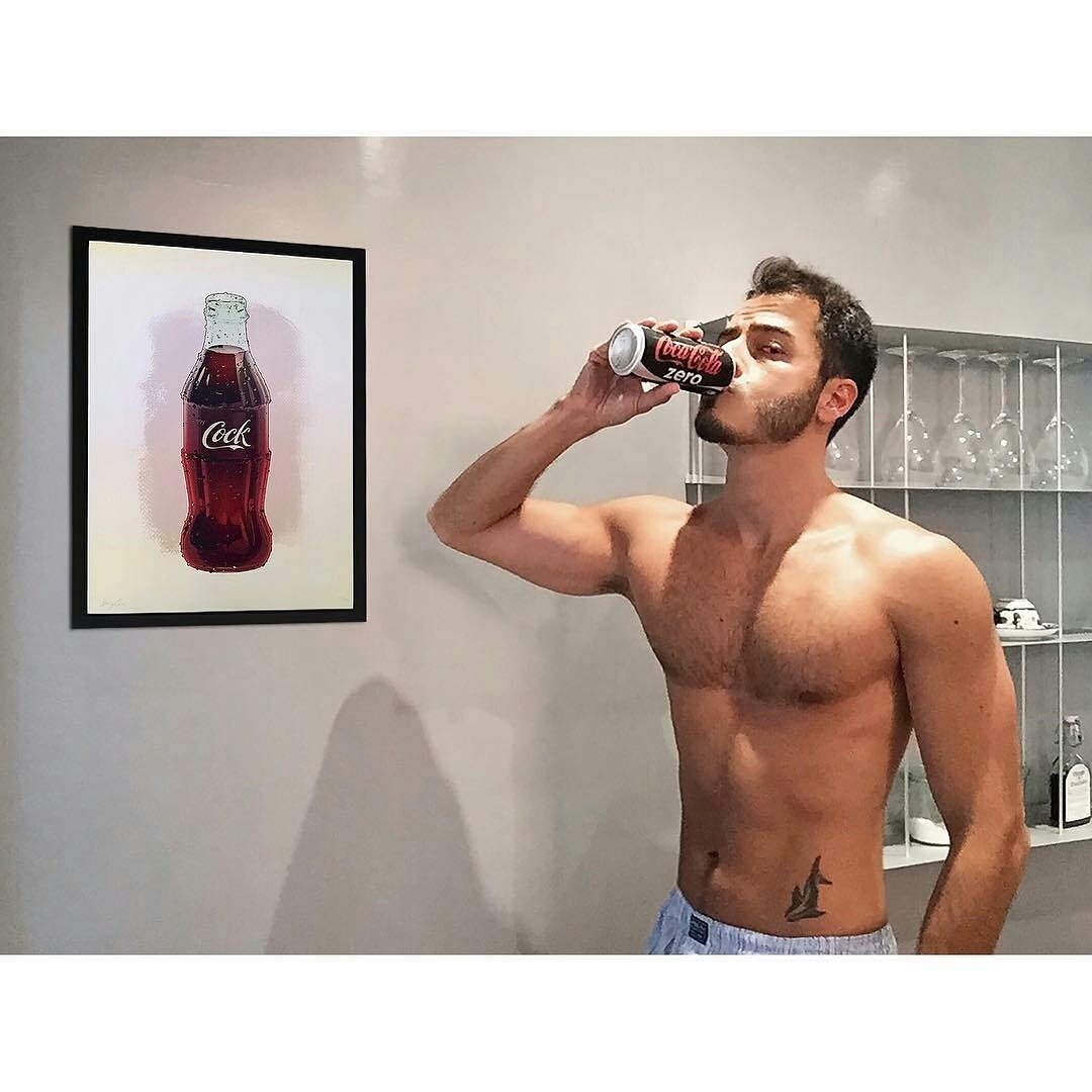 The Cock cola bottle print framed on a collector's wall